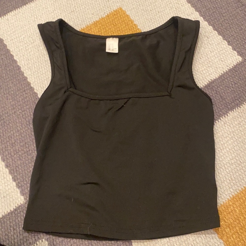 it’s a black tank top it’s low